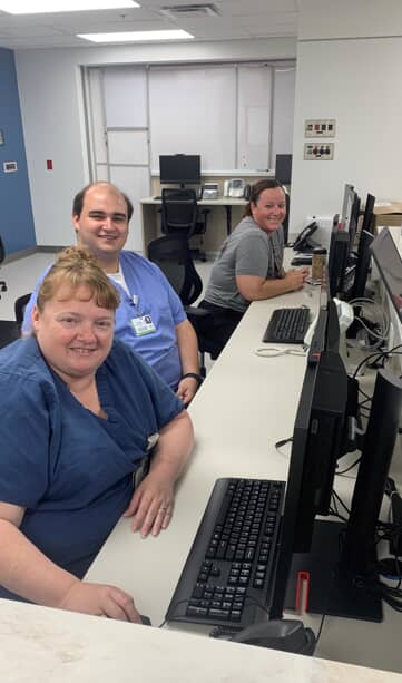 Daviess Community Hospital Emergency Department Director Christina Wininger, RN, BSN, as well as ED Coordinator Colton Williams and ED RN Janell Berry sit at the new nurses' station in the DCH ED.